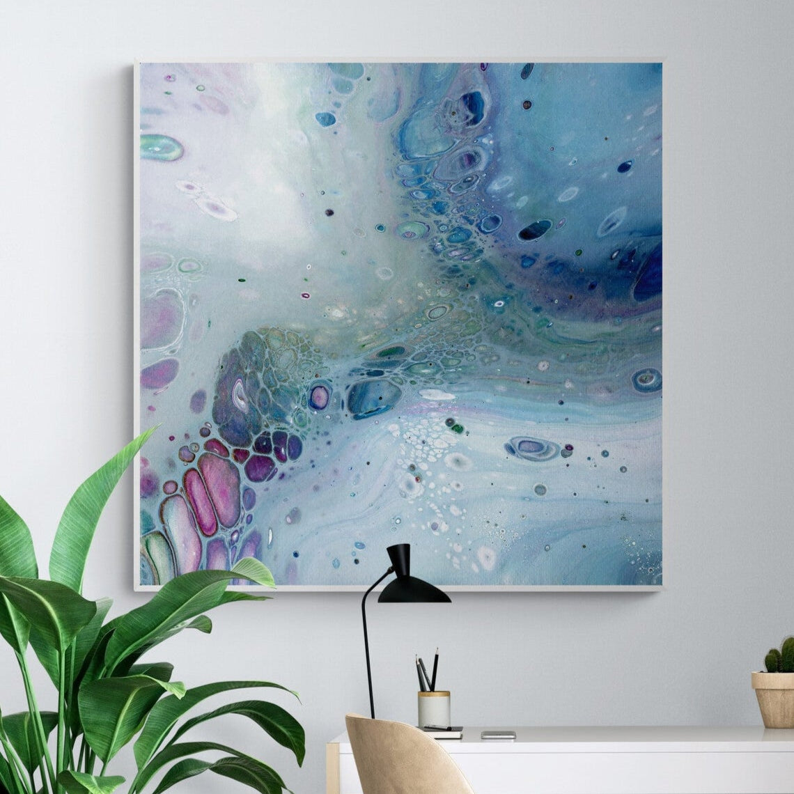 NL modern art-wall-art-canvas print gentle-pastel-1-in white frame in-home-office-with-large-tropical-plant