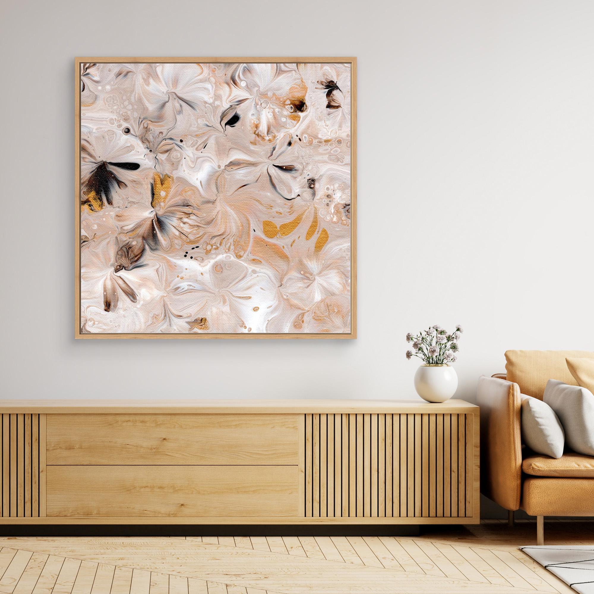 NL modern art Art Prints Soothing Neutrals 3 in oak frame on wall over wooden cabinet and white vase with flowers