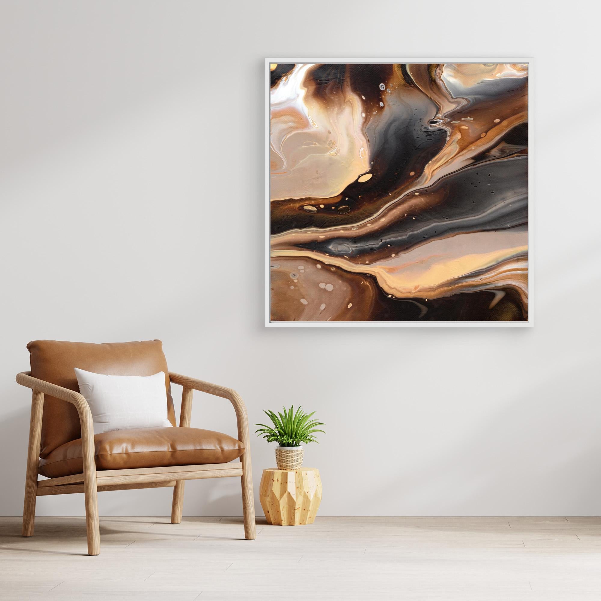 NL Modern Art Canvas Print Comforting Chocolate Caramel 2 in white frame on wall next to comfy chair and small plant