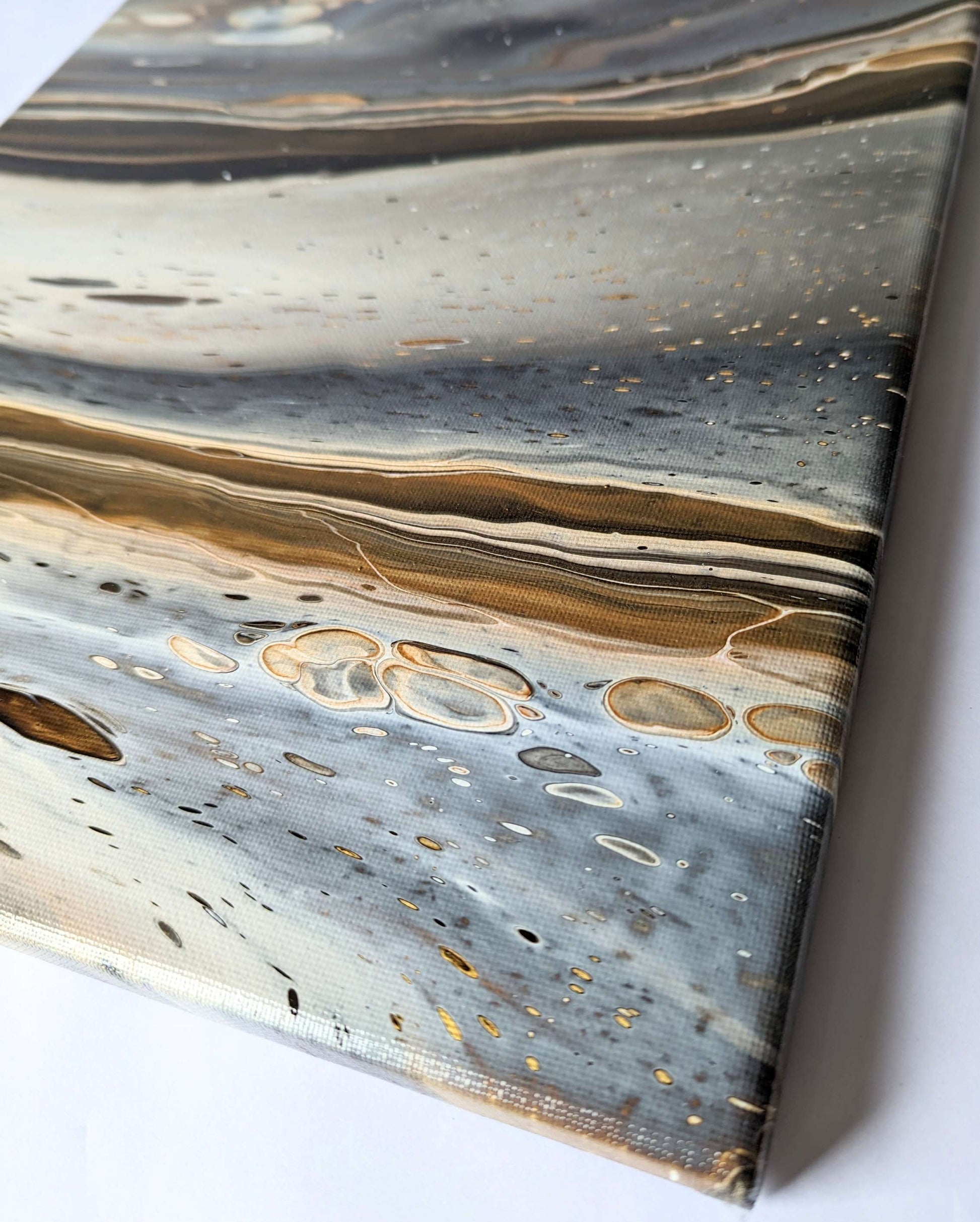 Detail of original abstract painting in grey hues with gold made with professional grade acrylic paint.
