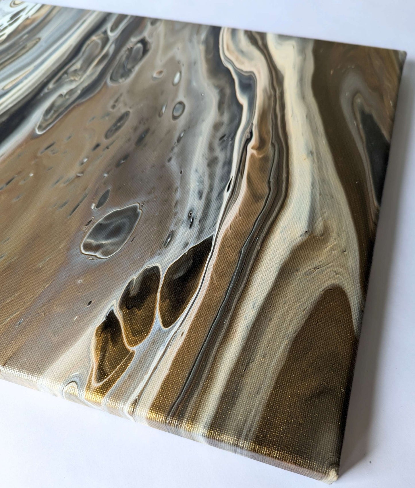 Detail of original abstract painting in grey hues with gold made with professional grade acrylic paint.