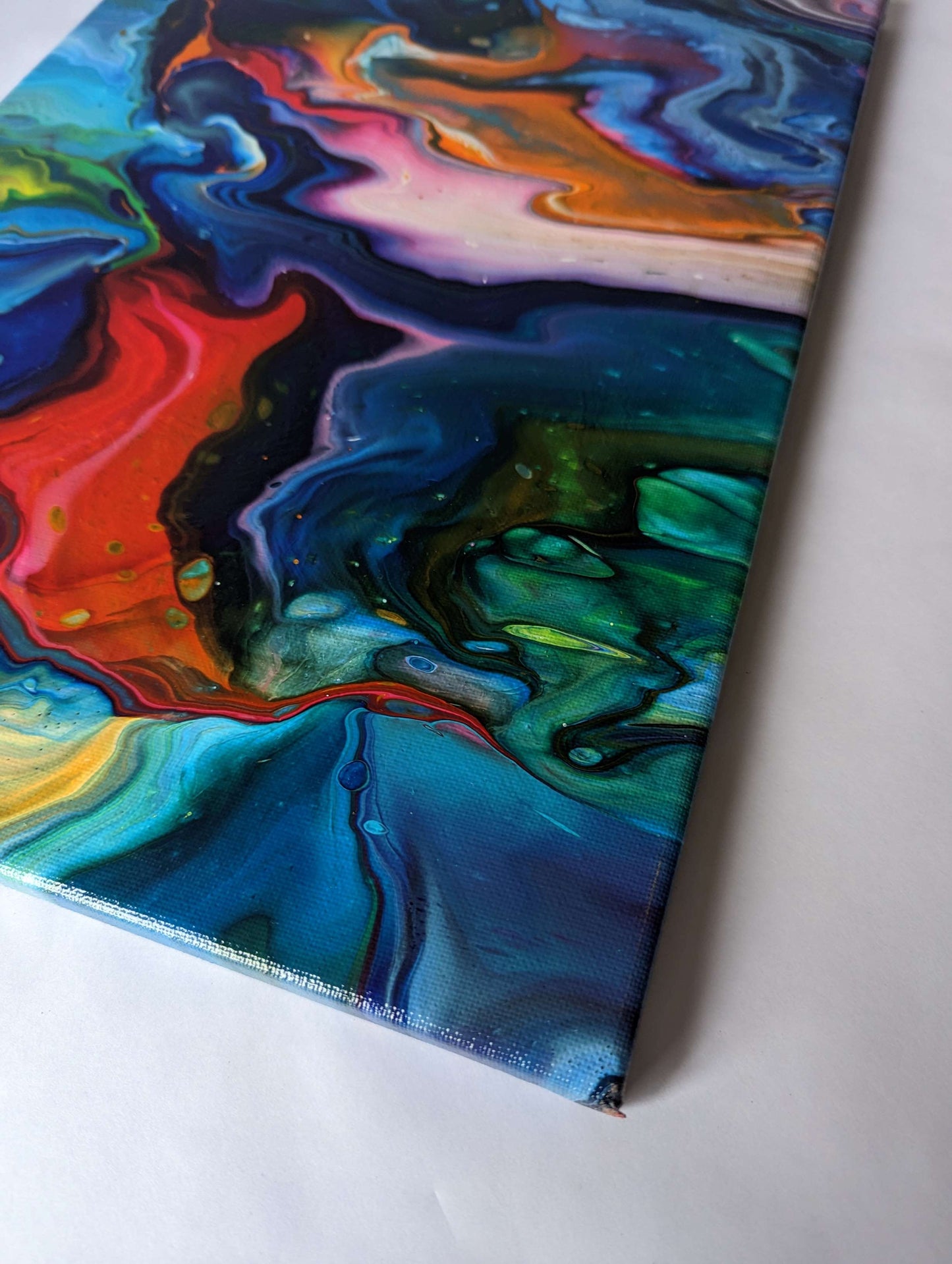 Detail of original abstract painting in vibrant colours made with professional grade acrylic paint.