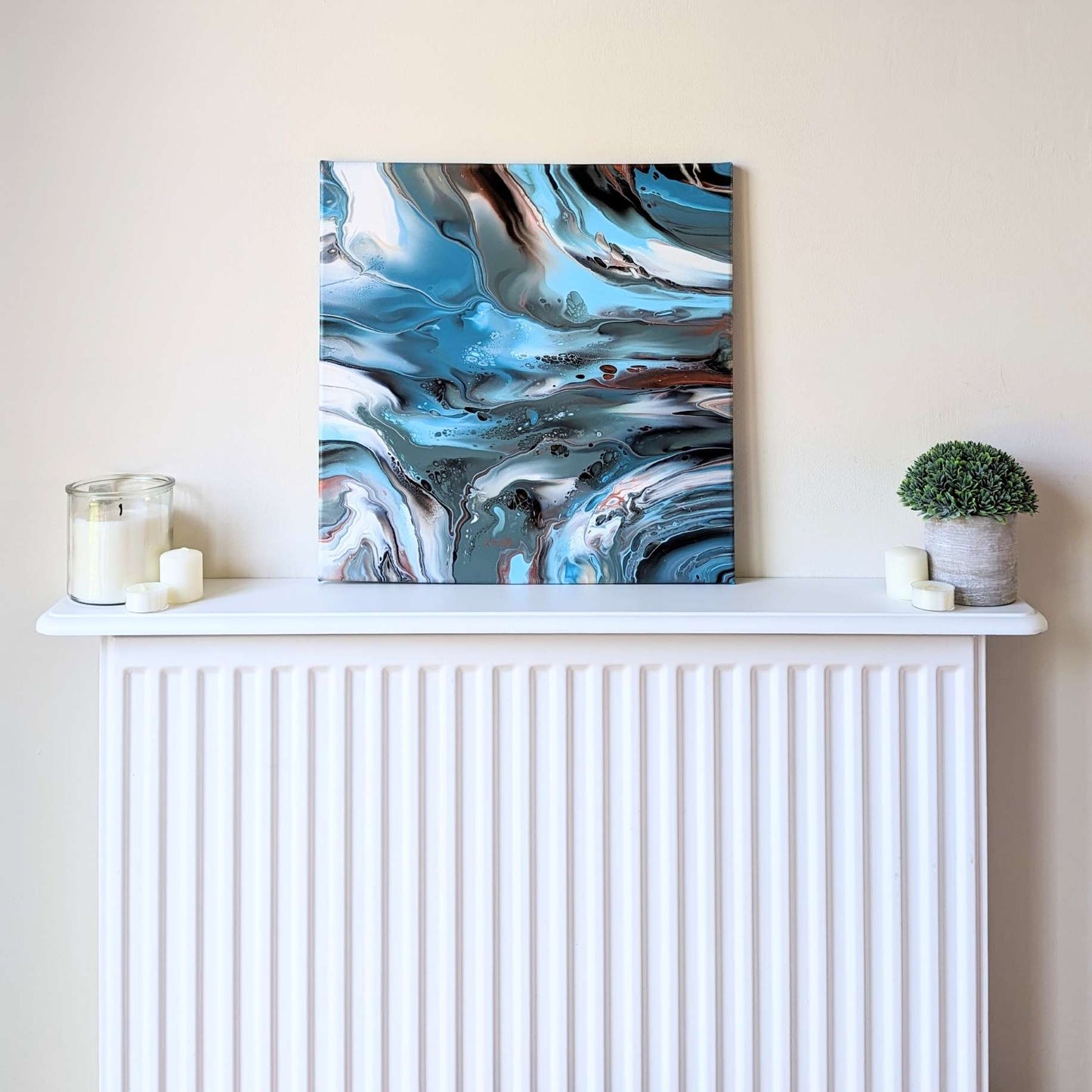 Canvas on shelf – frontal view of original abstract painting in muted hues made with professional grade acrylic paint.