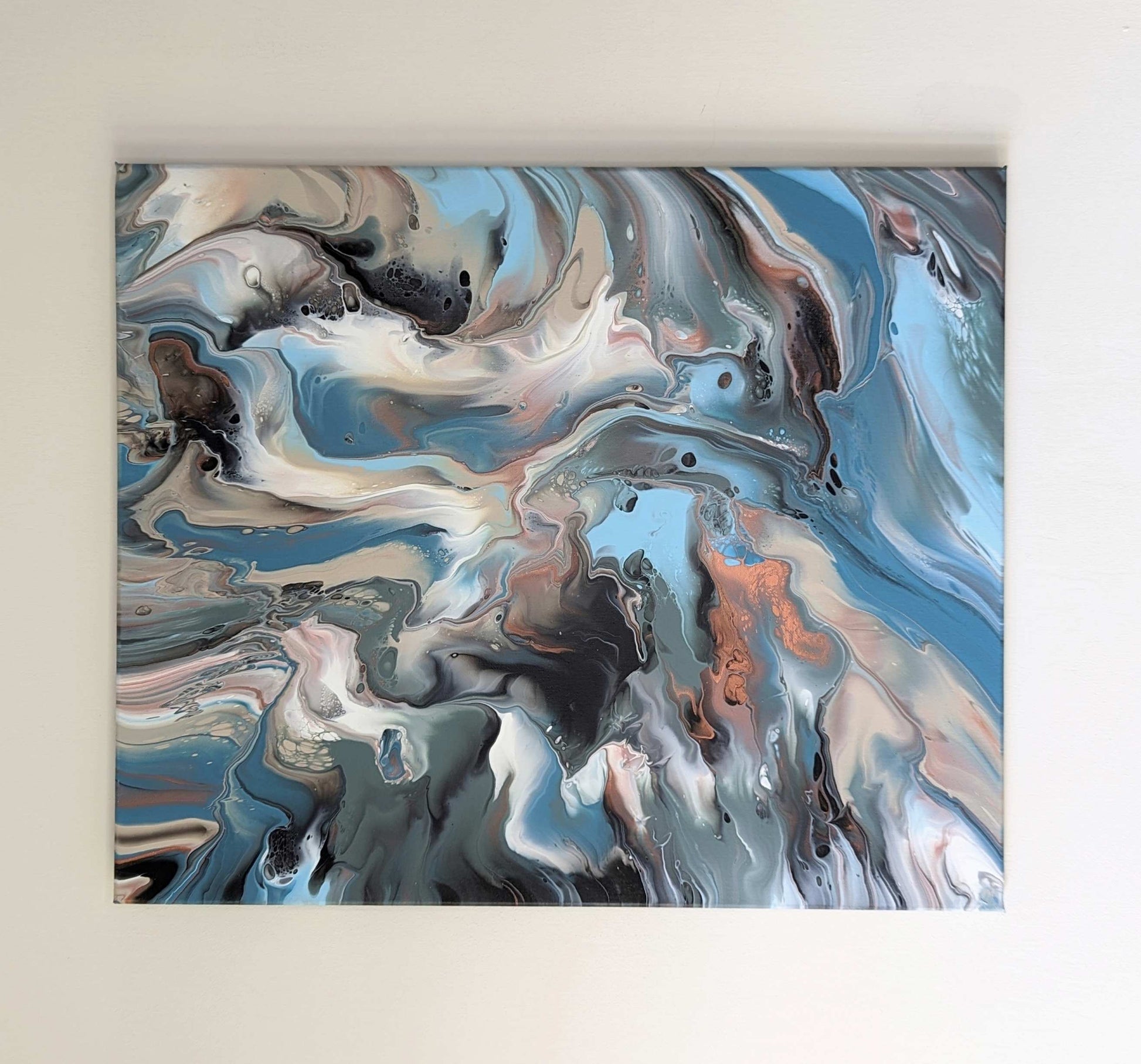 Canvas on wall – frontal view of original abstract painting in muted hues made with professional grade acrylic paint. Landscape orientation.
