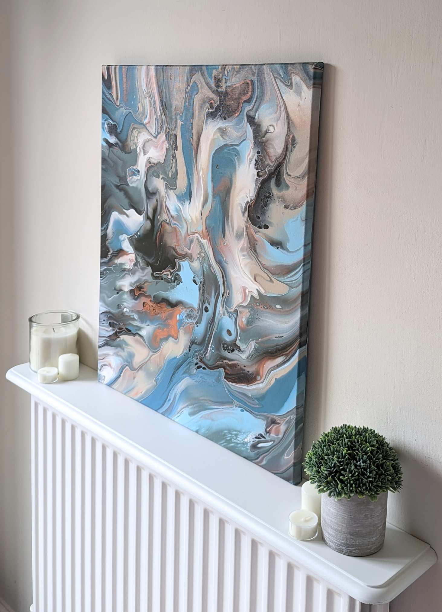 Canvas on shelf – side view of original abstract painting in muted hues made with professional grade acrylic paint.