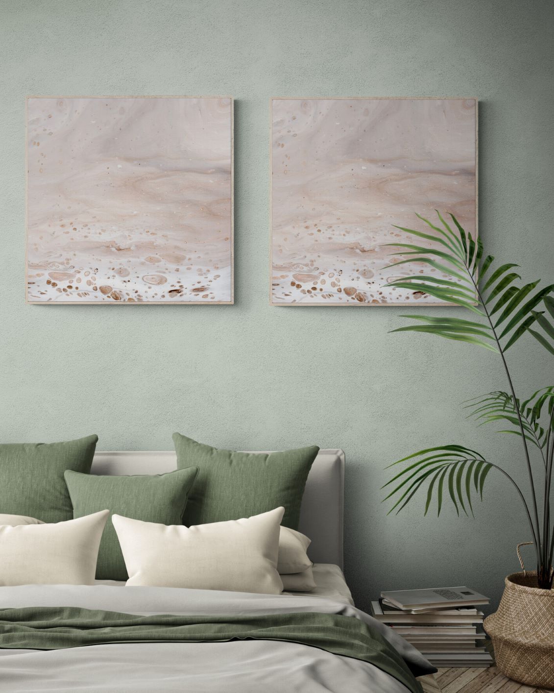 2 framed prints 70x70 cm in soothing neutral tones in a bedroom with a large tropical plant