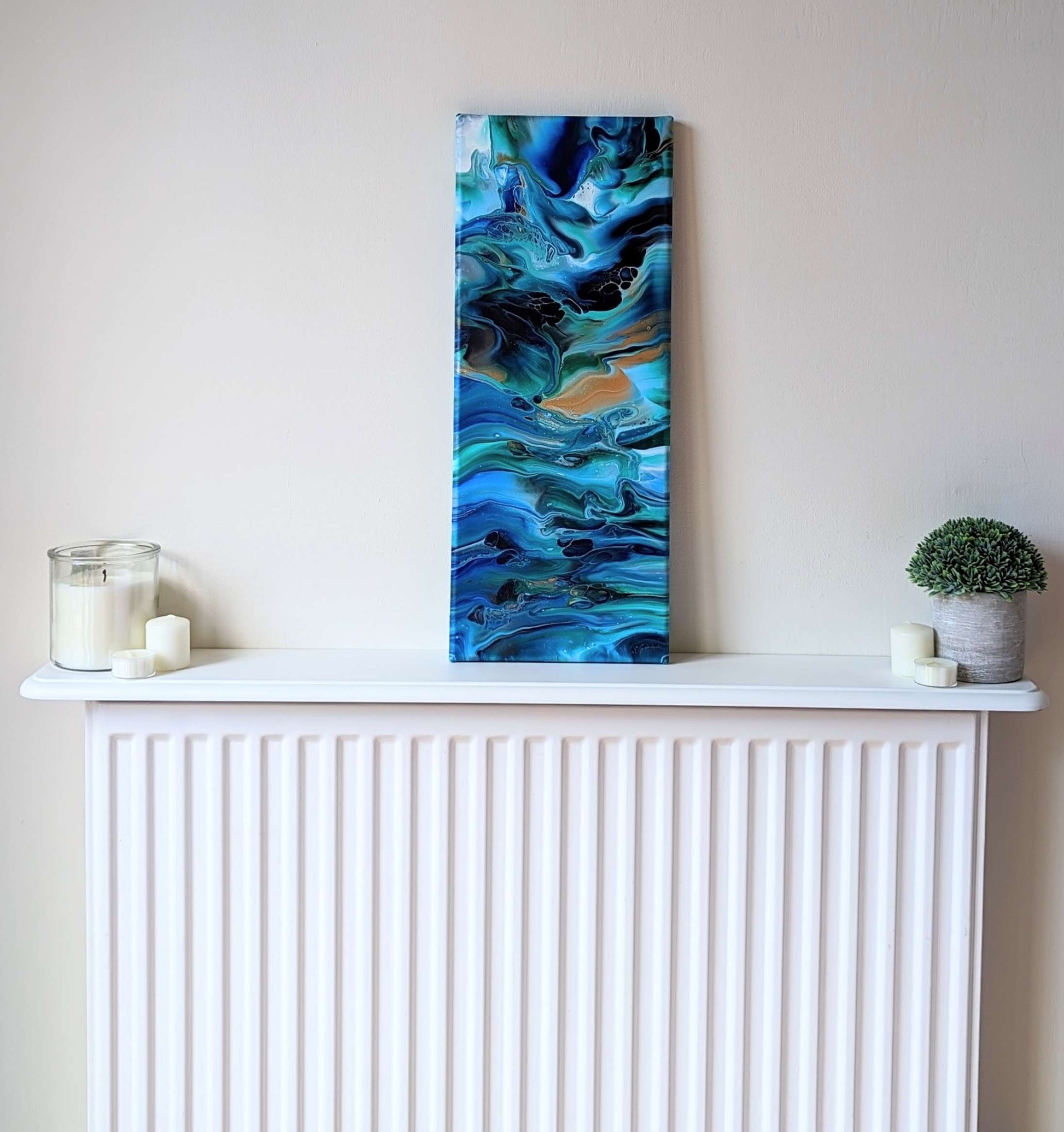 Canvas on shelf – frontal view of original abstract painting made with high contrast and gold professional grade acrylic paint.
