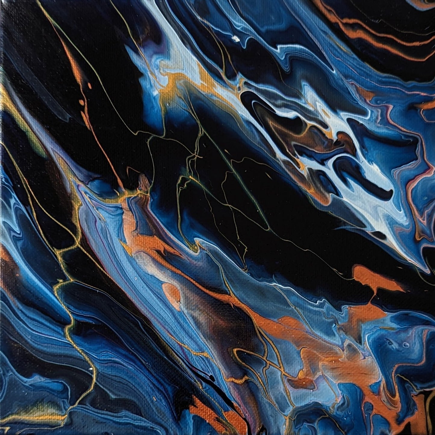 Close-up of original abstract painting made with Prussian blue and gold professional grade acrylic paint.