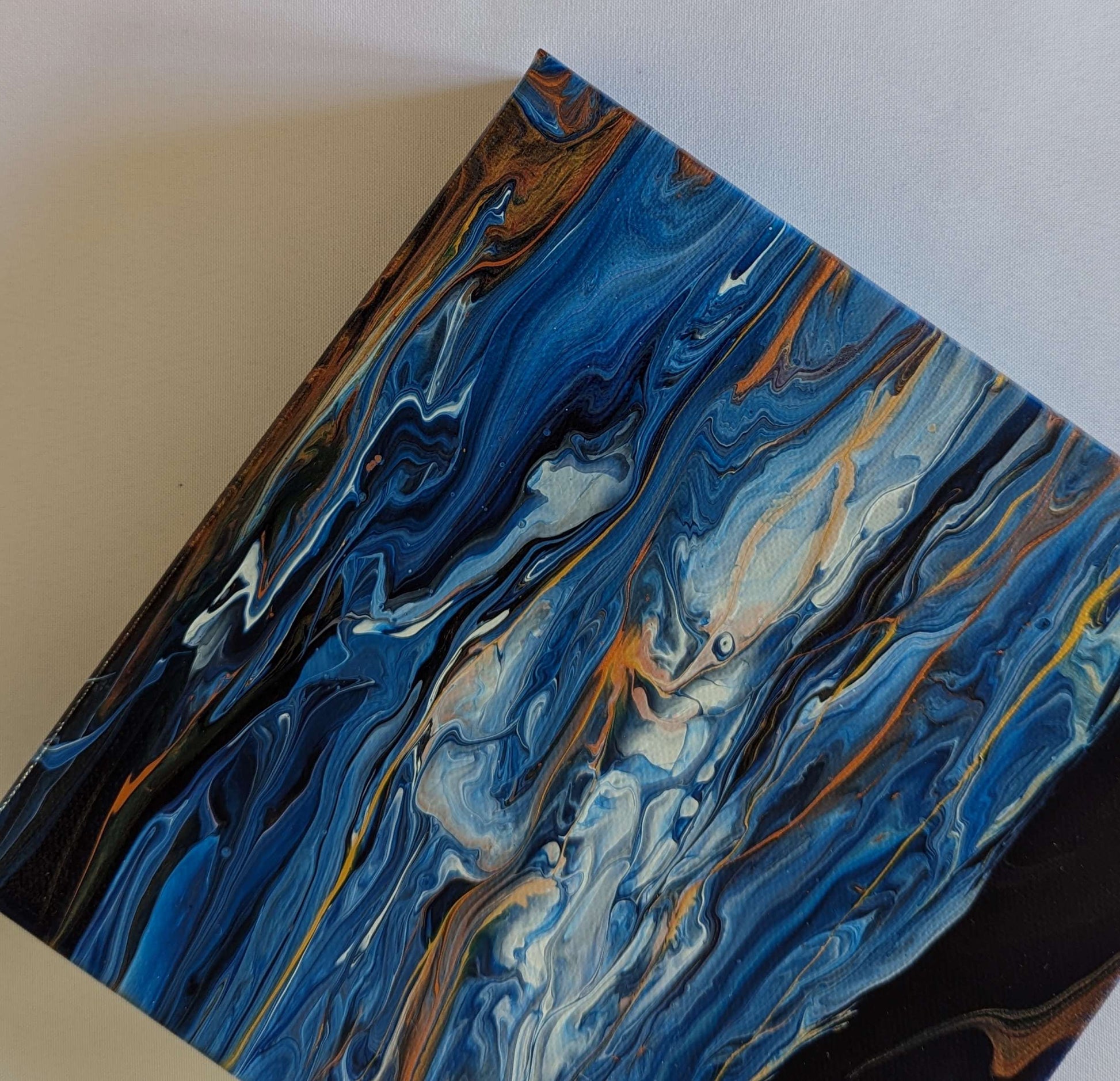 Detail of original abstract painting made with Prussian blue, copper, and gold professional grade acrylic paint.
